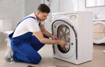 Man repair Backside Washing Machine